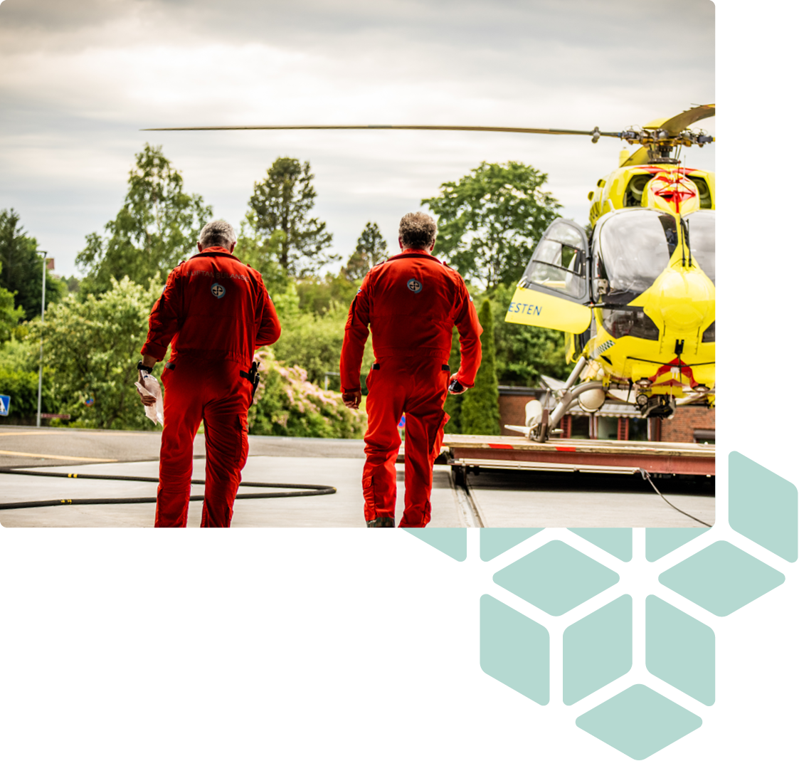 Two helicopter pilots walking toward air ambulance
